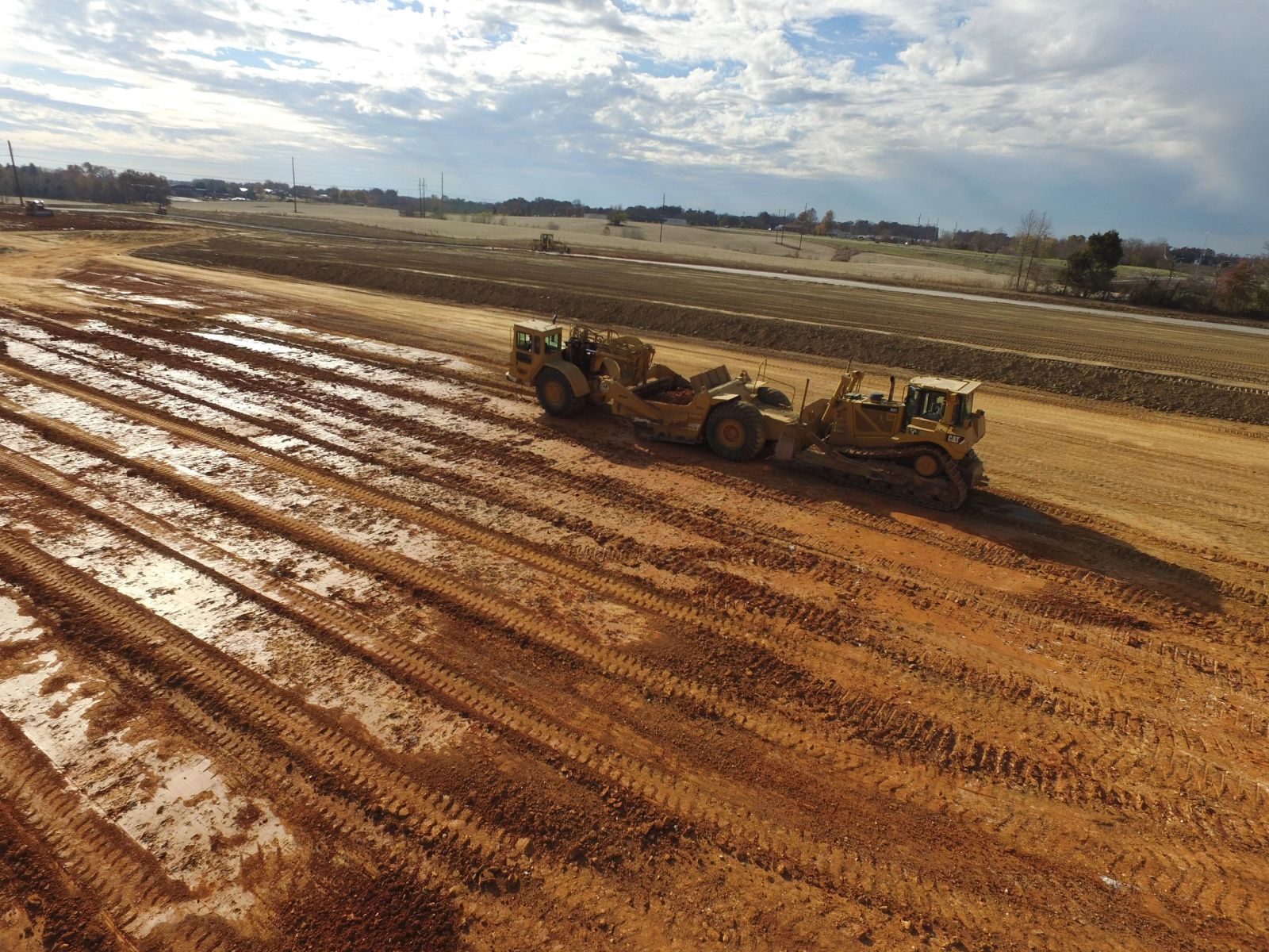 Earthmoving equipment shaping a construction site in central Kentucky